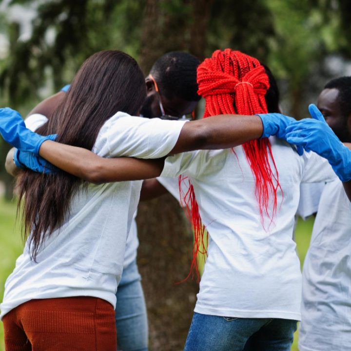 group-happy-african-volunteers-hugs-park-africa-volunteering-charity-people-ecology-concept